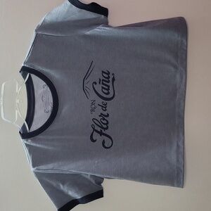 Flor de Caña cropped tee.